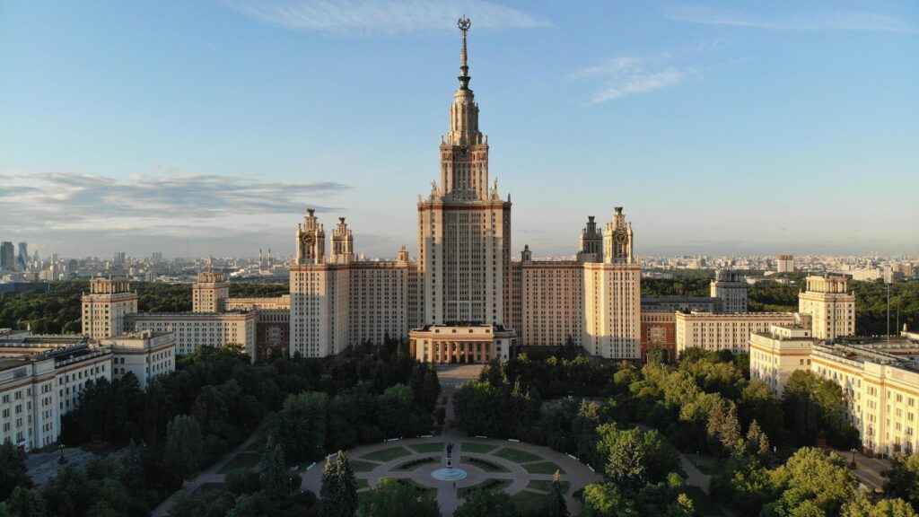 Majestic aerial shot of Moscow State University showcasing its classic architecture in an urban setting.